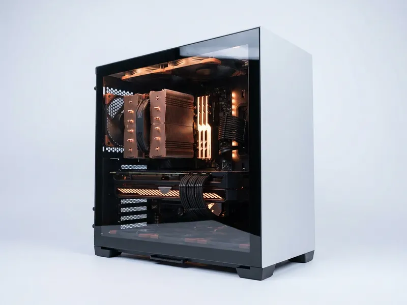Custom-built PC tower with tempered glass side panel showing internal components